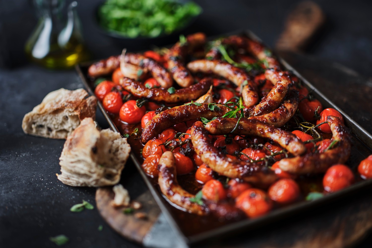 Summery sausage and tomato traybake recipe