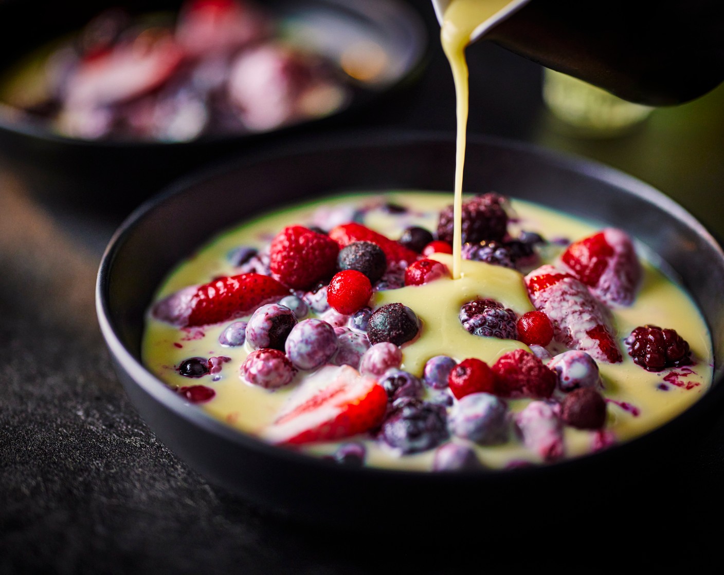 step 3 Pour the berry mix (350 g) onto a big platter then pour over the warm melted white chocolate. Serve with a glass of limoncello on the side.