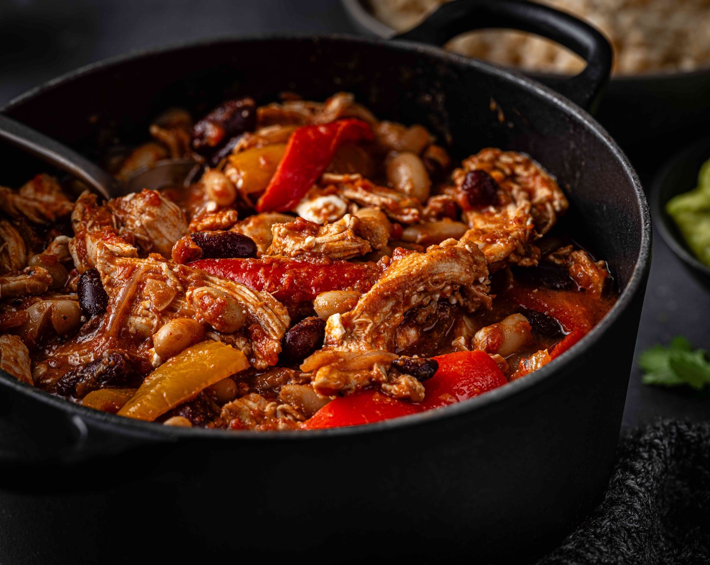 step 8 Just before serving, stir through the chopped coriander (1 bunch). Serve the rice topped with the chilli and with a dollop of guacamole (as needed), if you like.
