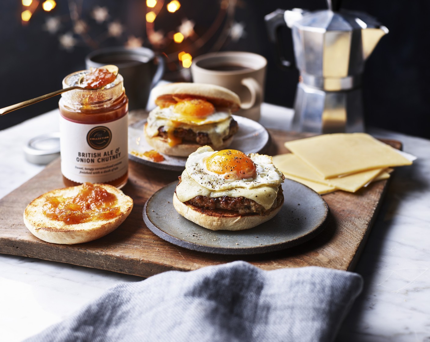 step 5 Top the cheese with the fried eggs, followed by a dollop of chutney (to taste) on each. Place the other halves of the muffins on top.