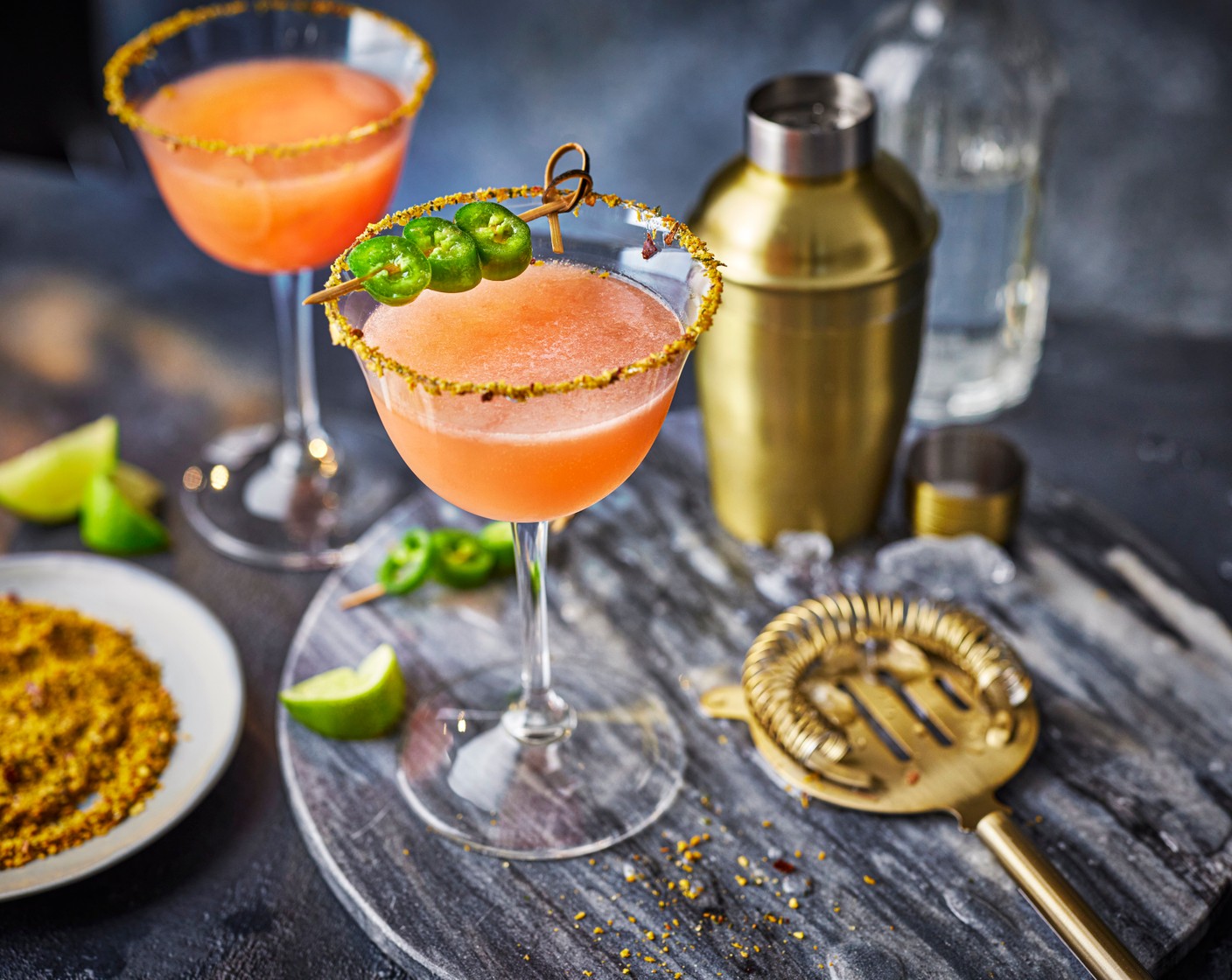 step 3 Strain into the glass. Top up with the soda (as needed) and garnish with three thin slices of fresh jalapeño (3/4).