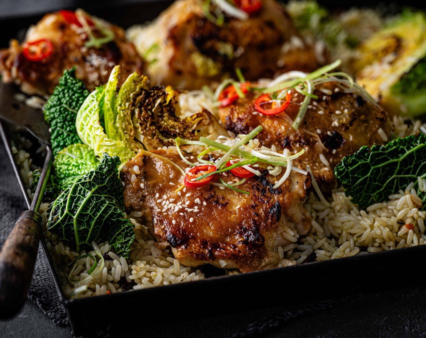 step 7 Serve the chicken and rice with the thinly sliced spring onions and chilli on top, followed by the sesame seeds (1 tbsp)