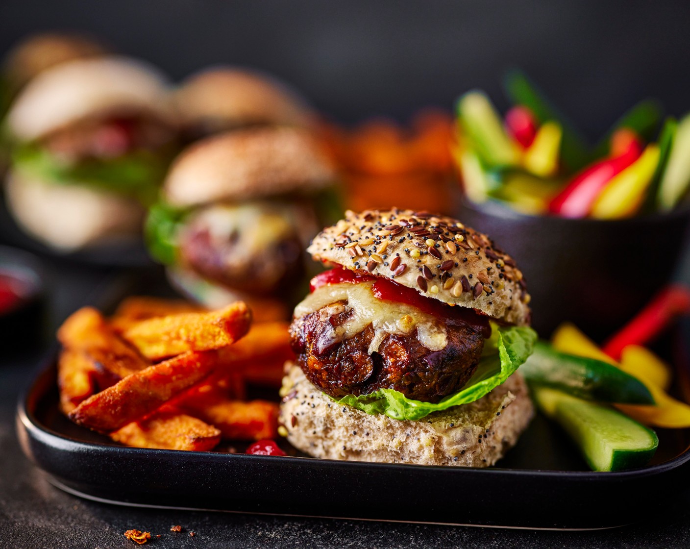 step 5 Slice the mini rolls (1 pack) in half and top with the burgers and lettuce (1). Serve alongside the thinly sliced baby peppers (1 pack) and baby cucumbers (1 pack), sweet potato fries and more smokehouse tomato sauce.