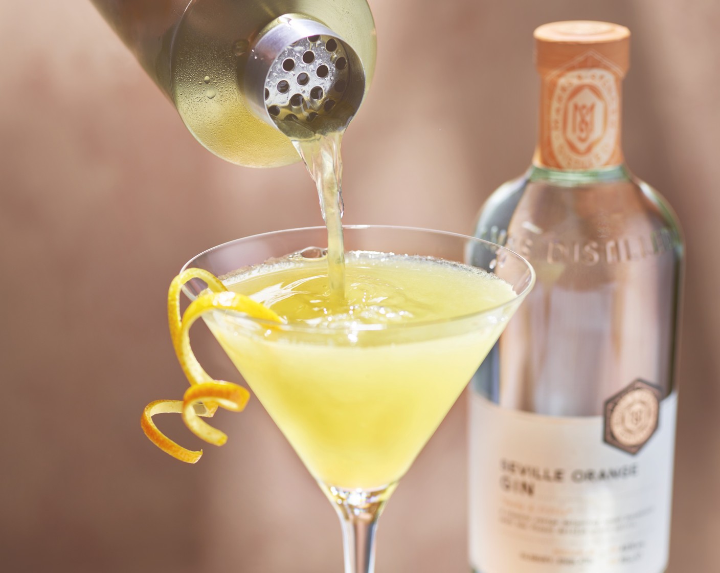 step 2 Strain into a martini glass and garnish with a twist of orange peel (to taste).