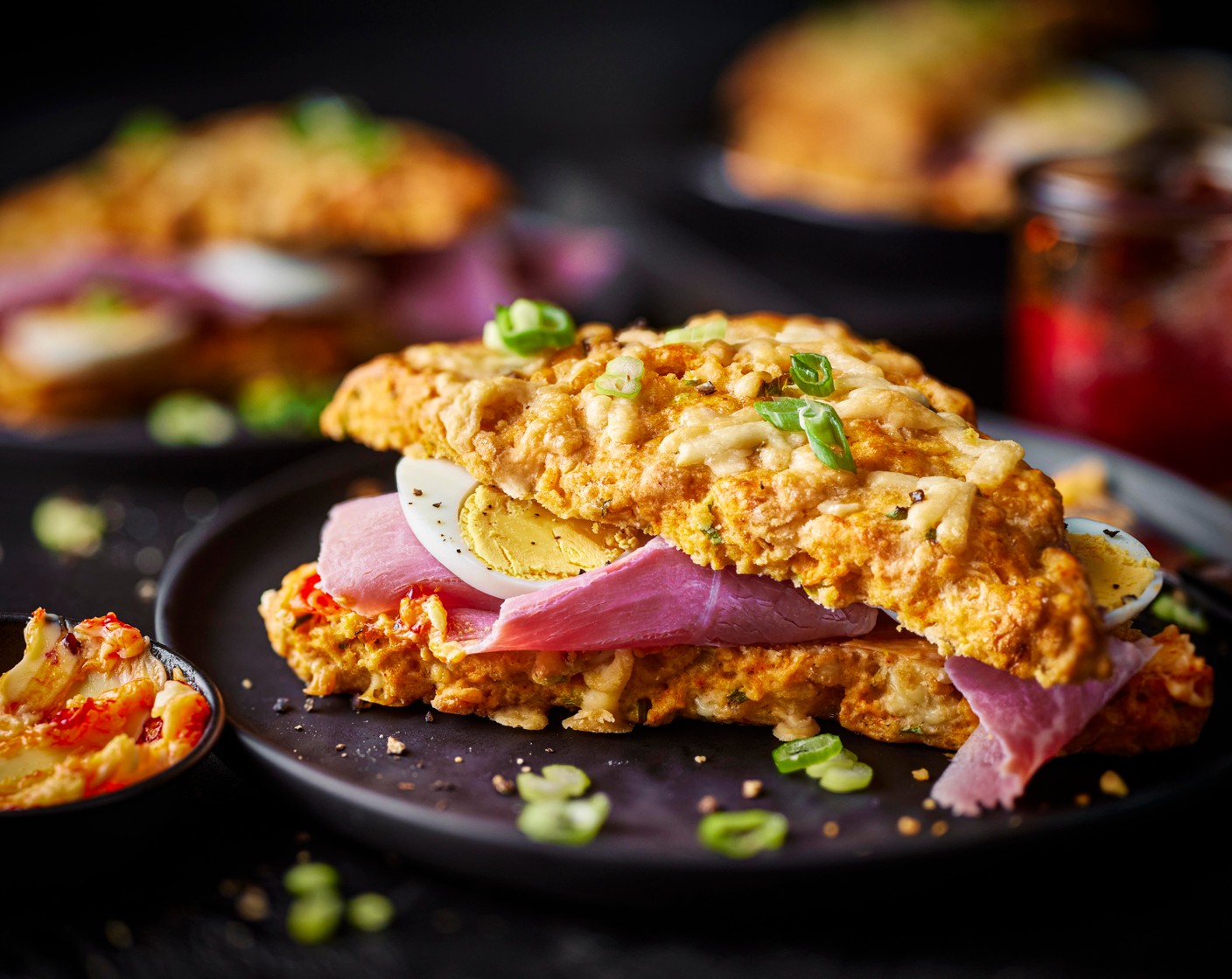 step 10 Serve the scones filled with the chilli butter, sliced eggs and ham (115 g).