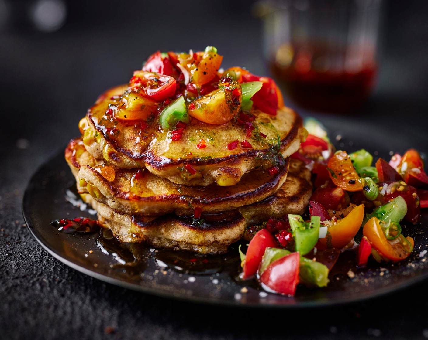 step 6 Serve the pancakes with a knob of butter on top, drizzle with the hot maple and served with the tomato salsa.