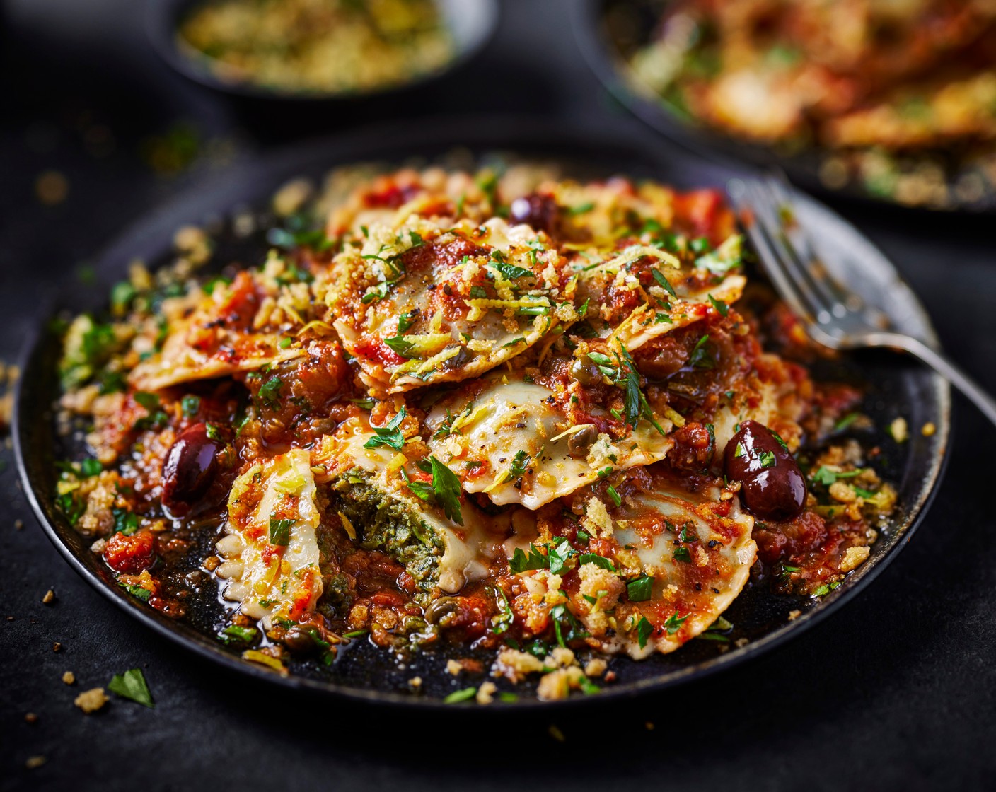 step 4 Return the pasta pan to a medium heat, pour in the aubergine and olive sauce (280 g), and simmer until piping hot. Toss through the drained ravioli and gently stir to coat. Divide between bowls and top with the golden breadcrumbs.