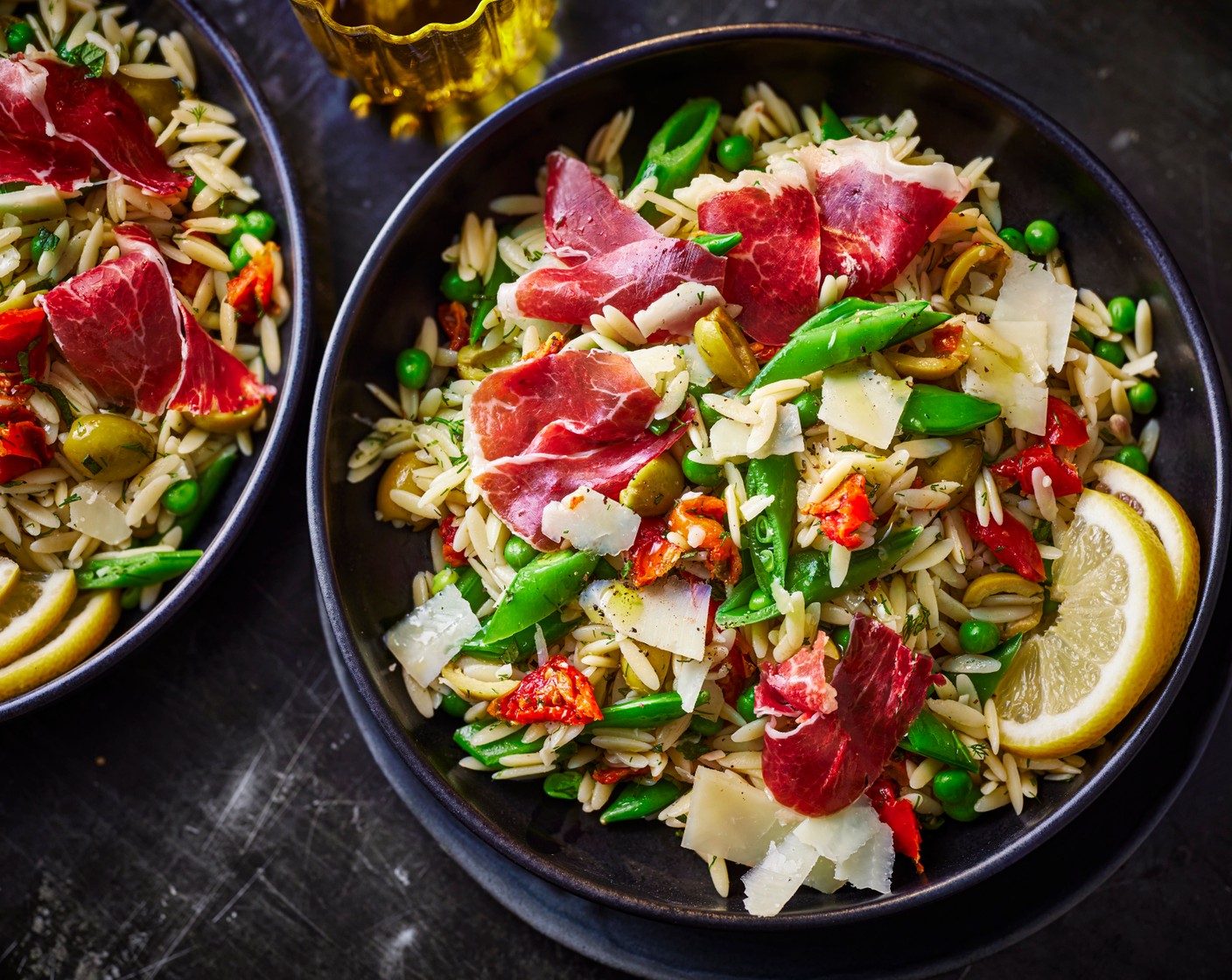 step 5 Serve in bowls and sprinkle each bowl with the Manchego cheese shavings. Top each bowl with a few slices of Ibérico ham (1 pack) and add a lemon wedge (1) to each bowl to serve.
