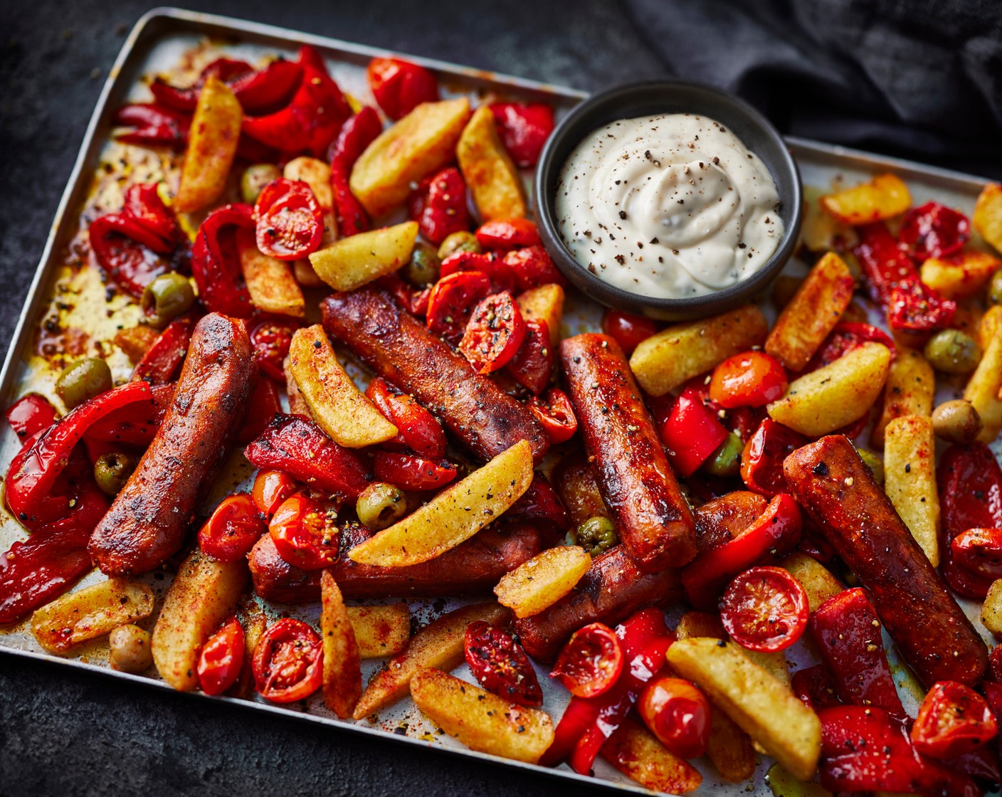 Smoky Spanish-style sausage traybake and aioli