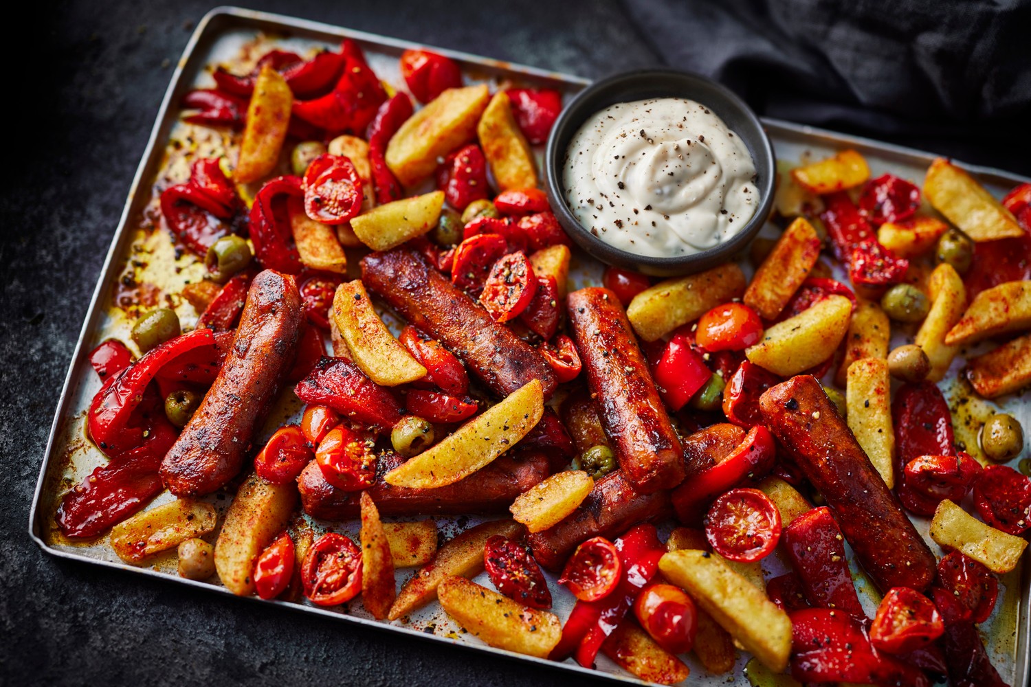 Smoky Spanish-style sausage traybake and aioli