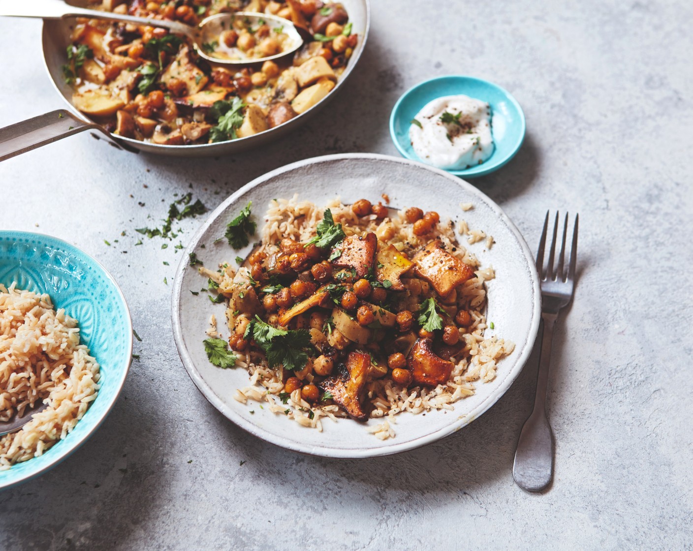 step 5 Divide the curry and rice between four serving bowls. Serve each with a wedge of lime wedge (1), some coriander (1 handful) and a spoonful of the coconut pot (2 tbsp).