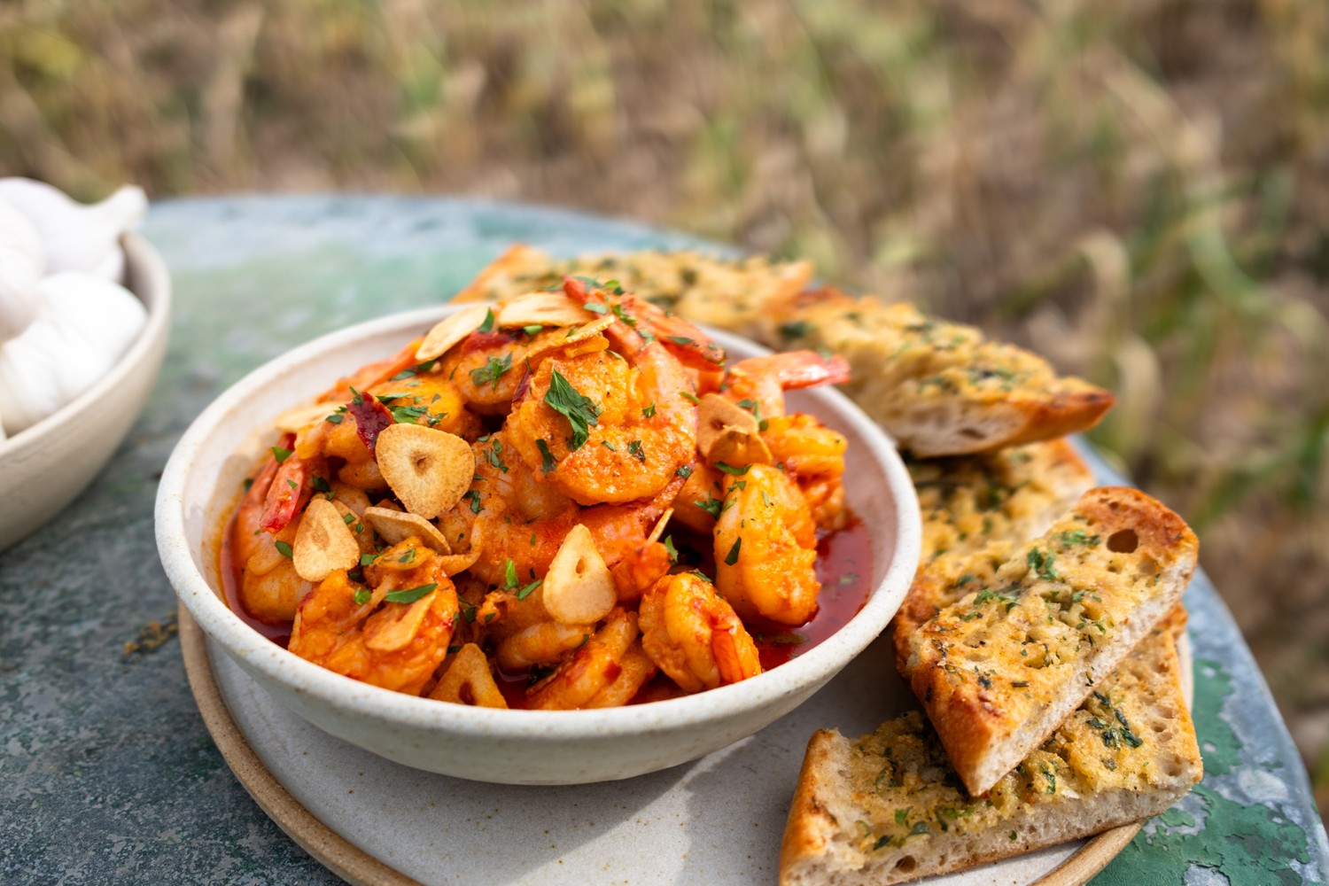 Spanish-style garlic prawns with roasted garlic toasts recipe