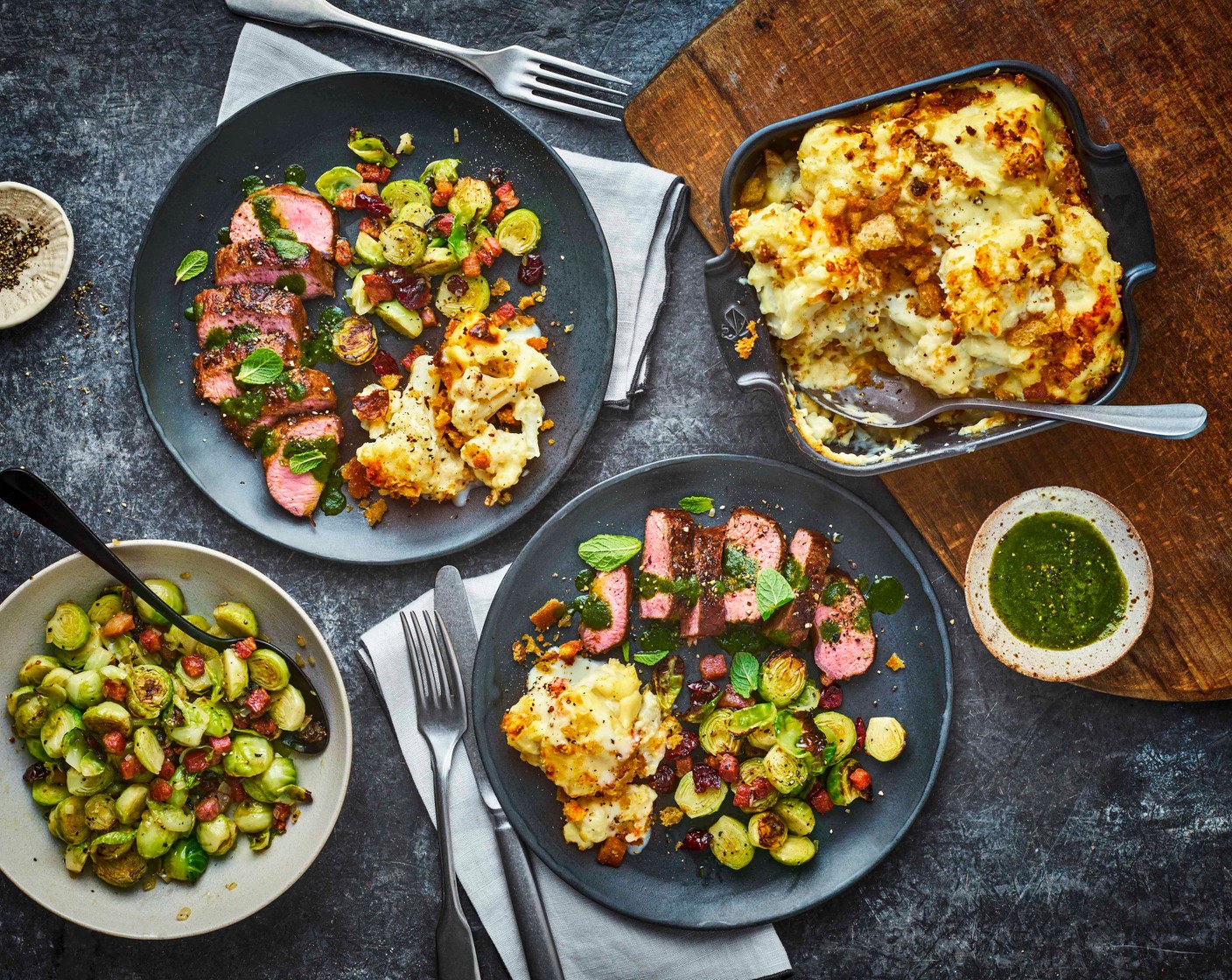step 12 When you’re ready to eat, slice the lamb and serve with the cauliflower cheese, sprouts and mint sauce.
