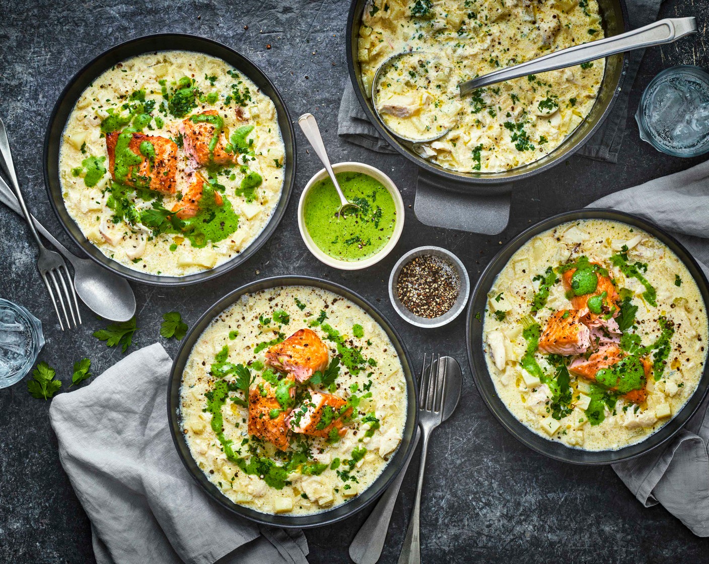 step 8 Pour the soup into warmed bowls, pile up the chunky pieces of haddock in the centre and top with the salmon. Pour the smooth green sauce around the outside and sprinkle with any extra parsley to serve.