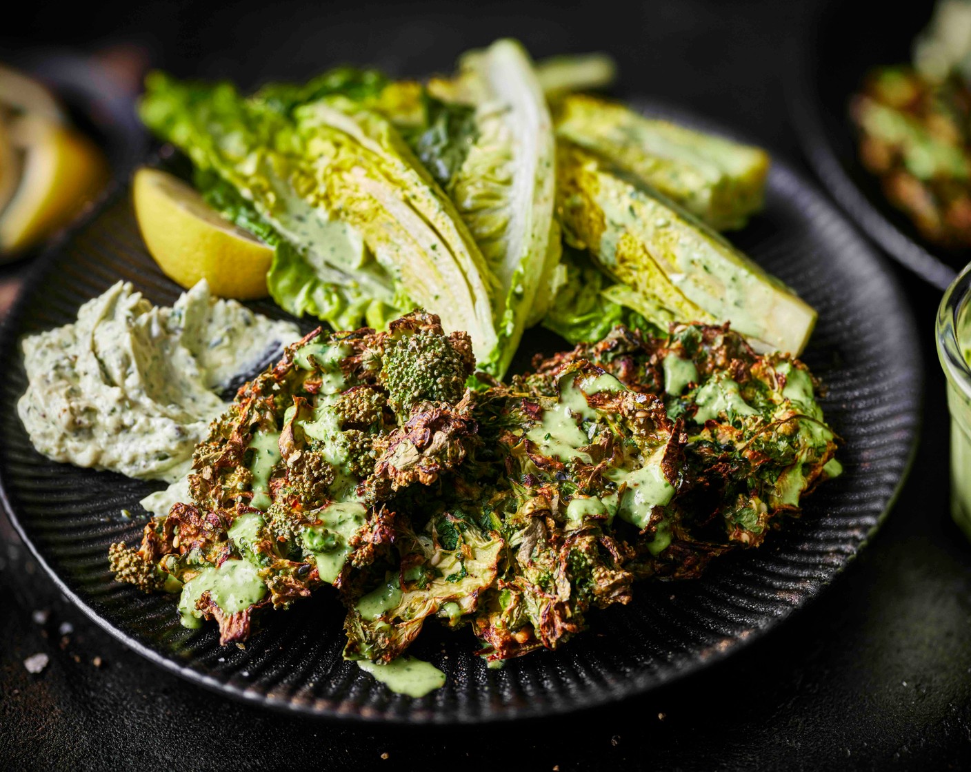 step 7 Serve the fritters with the whipped feta (4 tbsp) and the green goddess salad, plus a wedge of lemon, and an extra drizzle of dressing (1/2 pack).