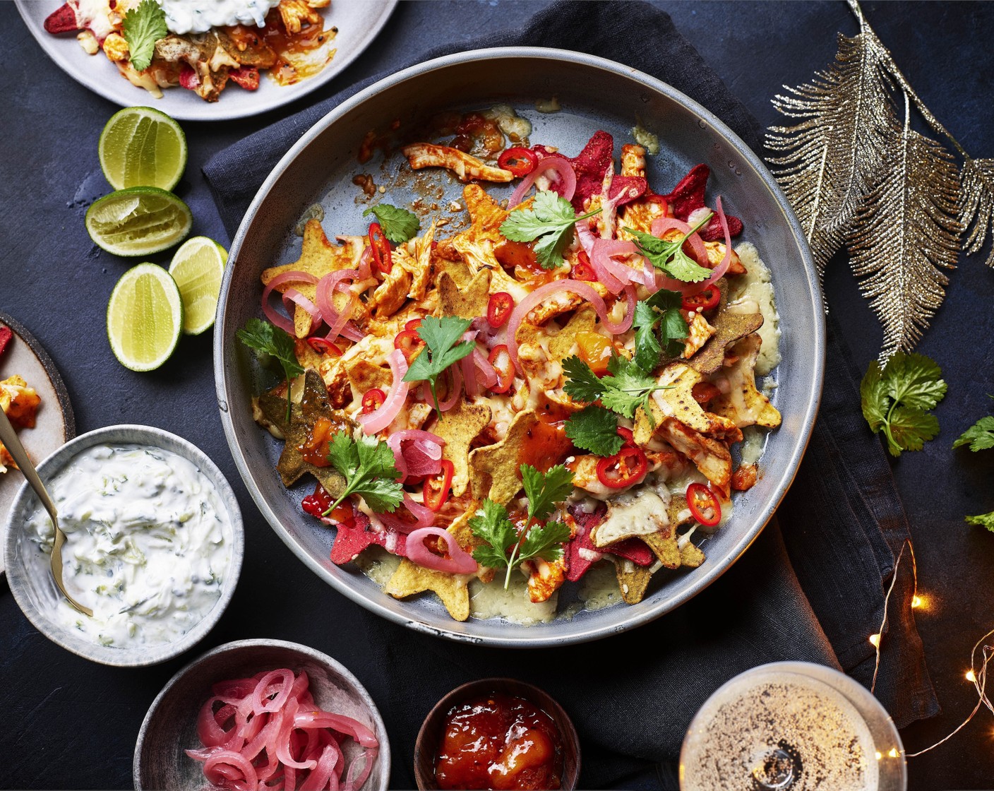 step 6 Remove the nachos from the oven and top with the remaining coriander, blobs of mango chutney (1 tbsp) and pickled red onions (1 tbsp). Serve with the homemade raita for dunking.