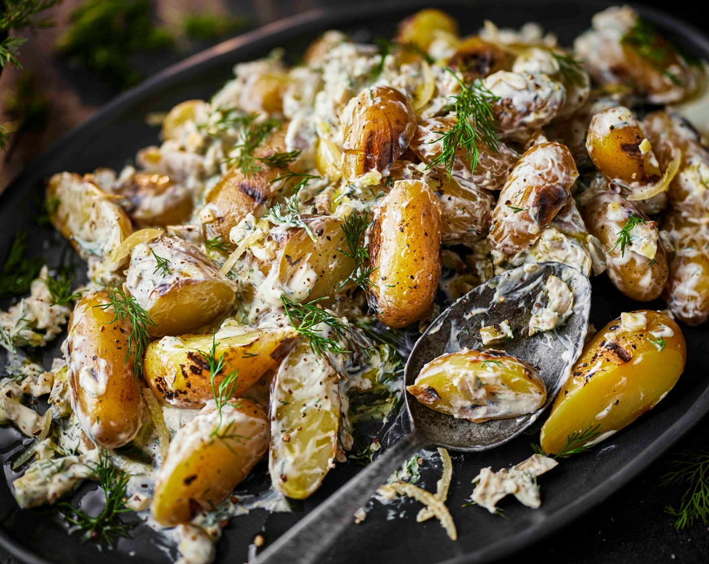 step 6 Halve the grilled potatoes and toss them through the dressing, then serve.