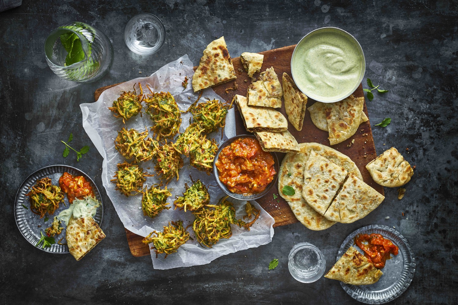 Lamb paratha with mint yogurt and pakoras