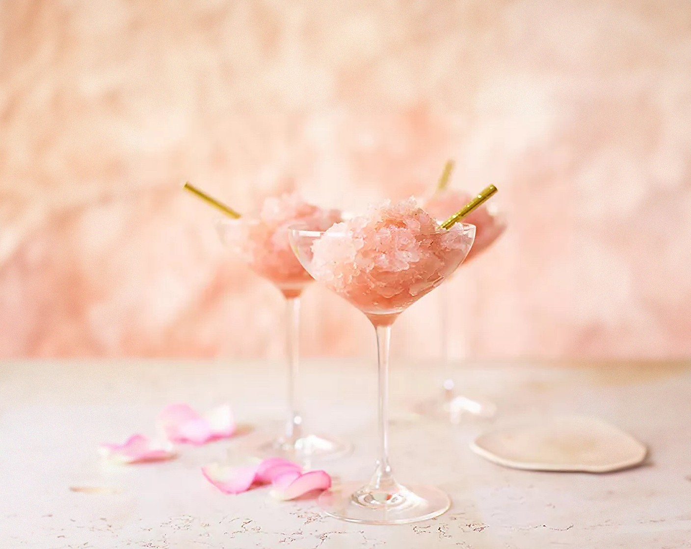 step 3 Serve in champagne coupes with mini straws, and toast the sunshine with a pretty-in-pink drink.