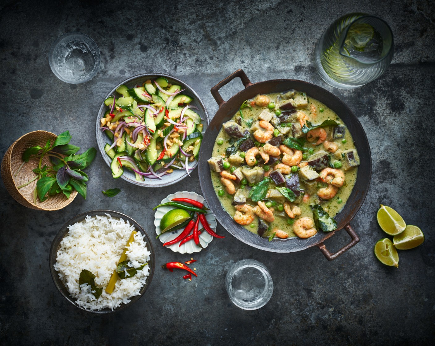 step 7 Divide the curry, coconut rice and salad between serving dishes and serve with the lime wedges (2).