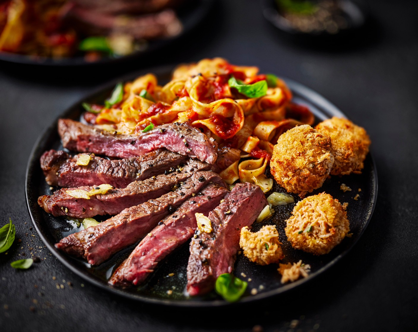 step 9 Slice the steak against the grain and serve with the linguine and bonbons, topped with the basil leaves (10 g).