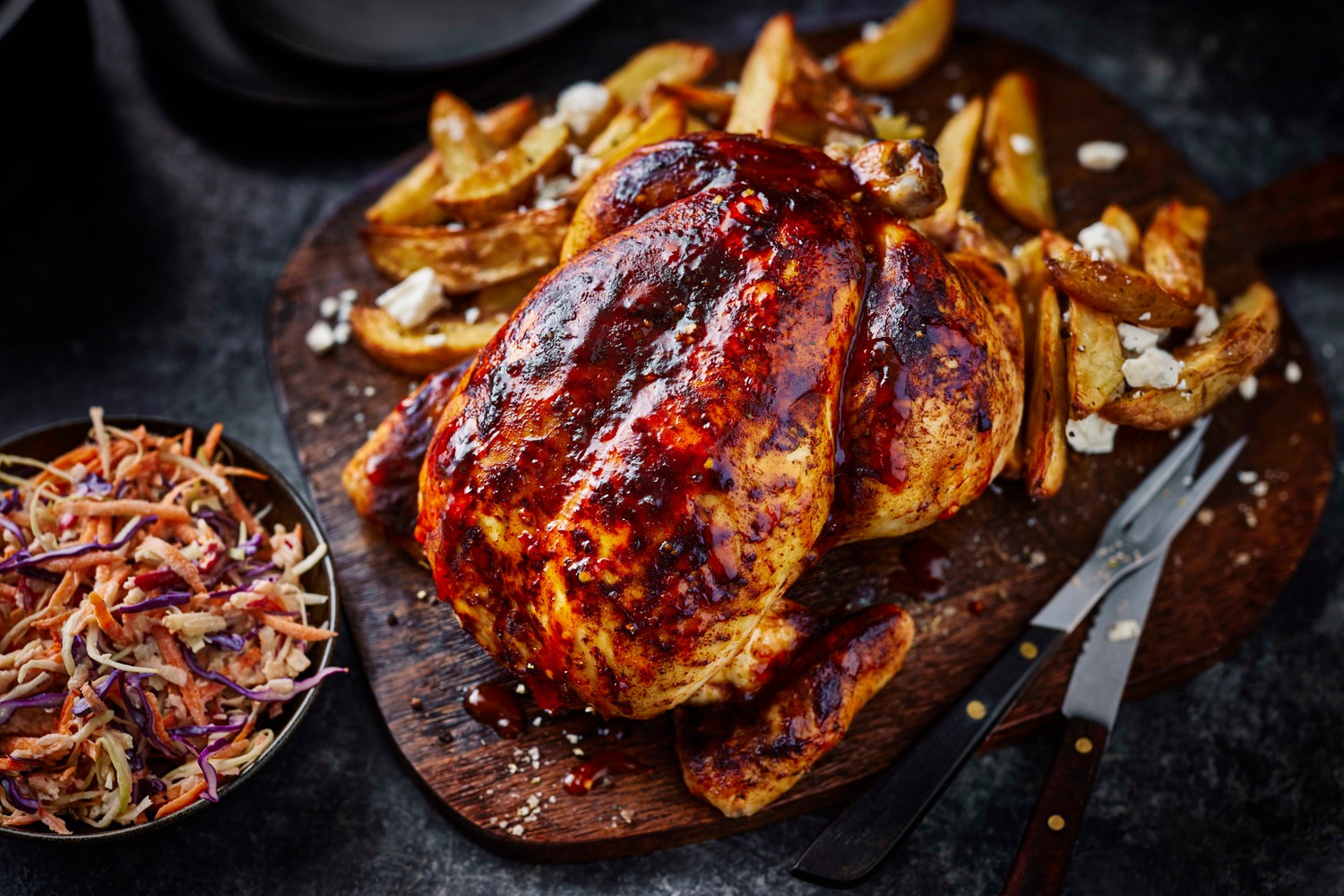 Hot honey chicken with rosemary and feta potato wedges and creamy slaw
