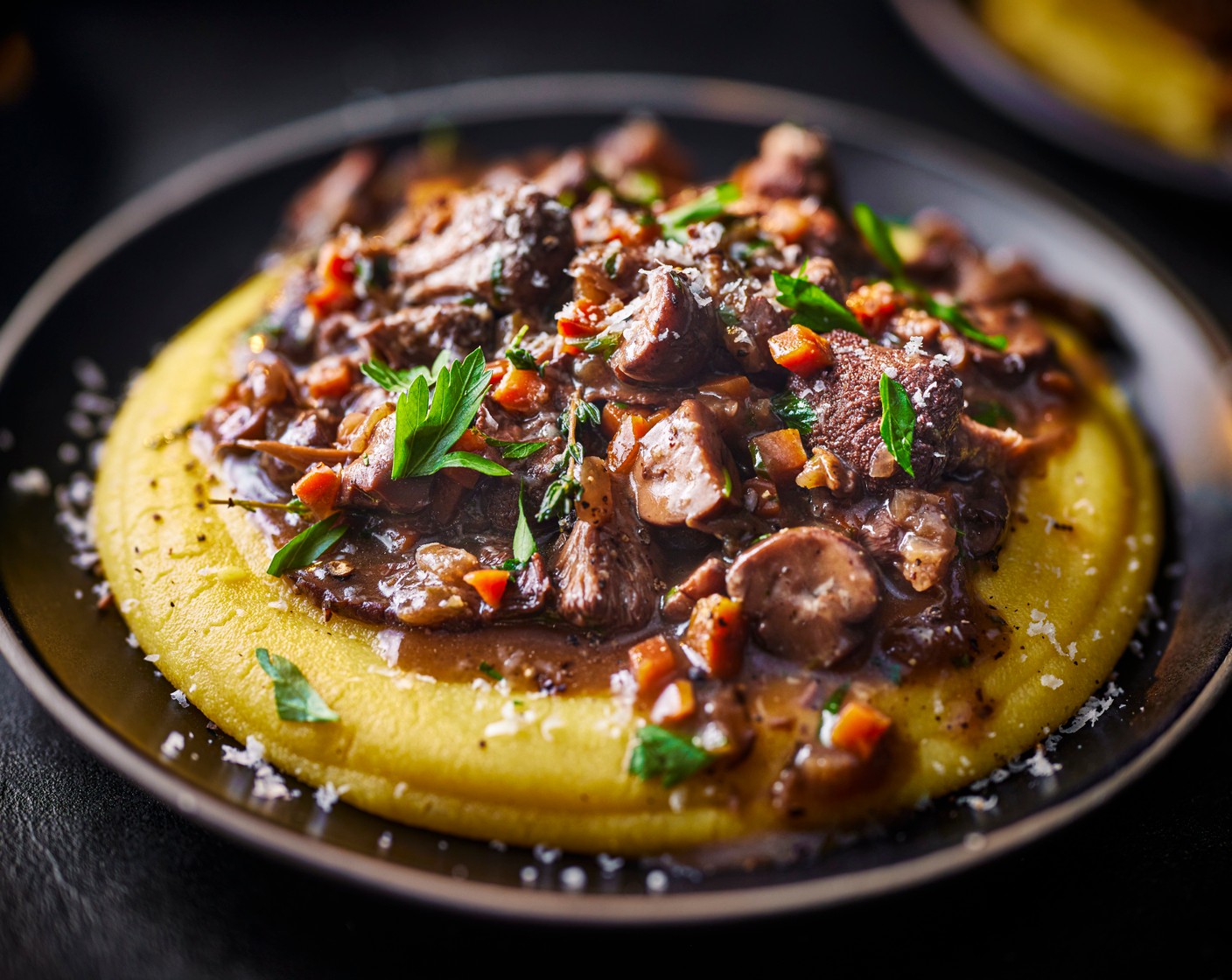 step 8 Stir the fresh parsley (10 g) through the mushroom ragu. Spoon the polenta into bowls and top with the mushroom ragu. Serve with extra parmesan, if you like.
