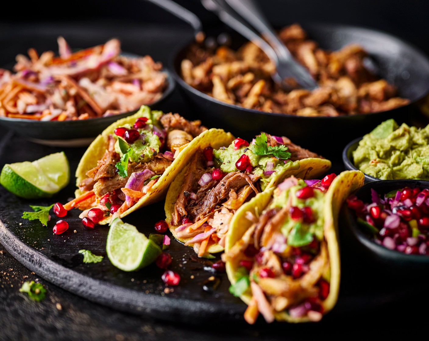 step 8 Serve the tacos alongside the cooked turkey, guacamole (1 tub), slaw and pomegranate salsa in bowls so everyone can help themselves.