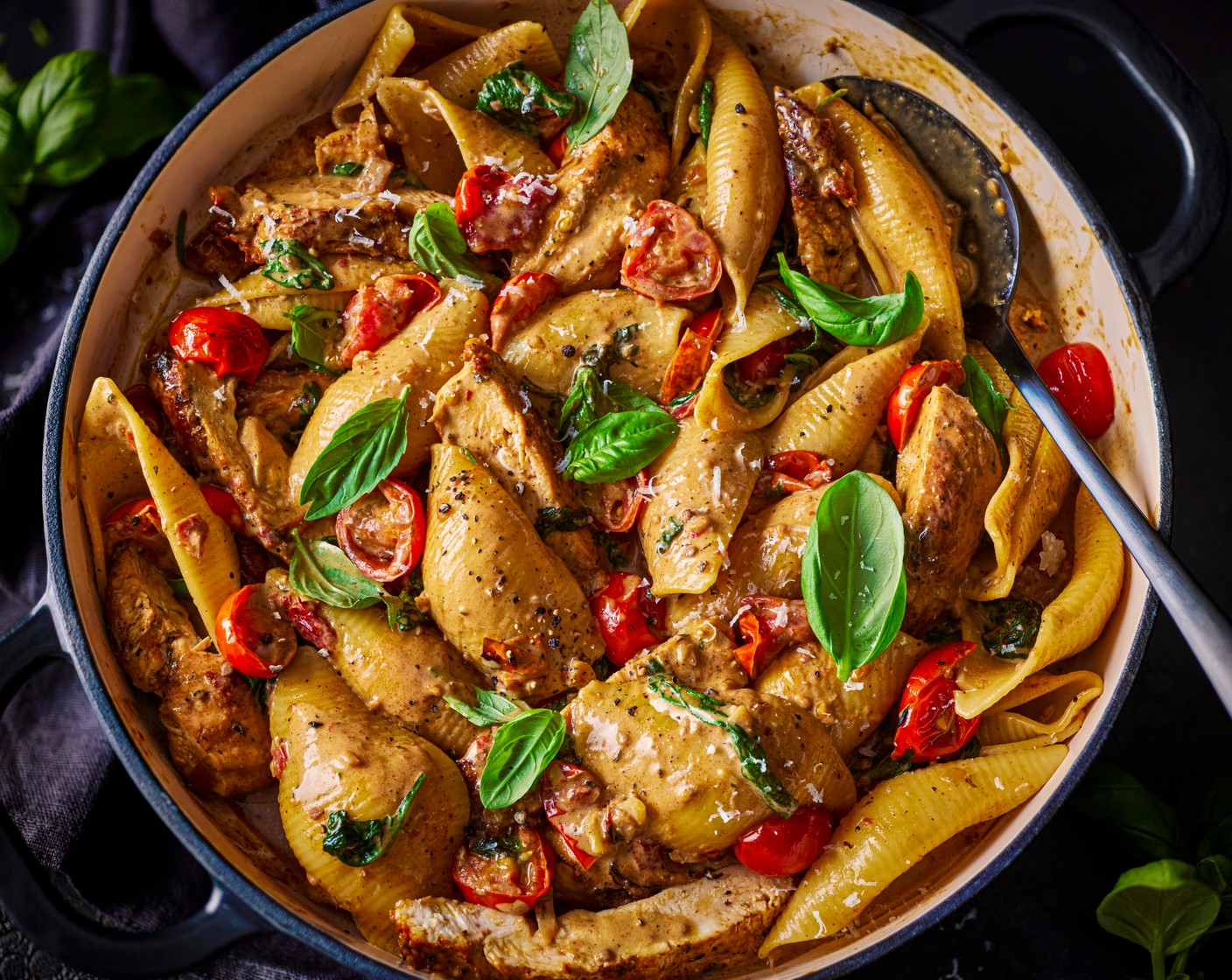 step 6 After the sauce has simmered for 5 minutes, stir the double cream (100 ml) into the sauce and add the garlic and herb butter (1 knob) and grated parmesan (1 tbsp). Return the chicken breast to the pan to warm through for 4-5 minutes and then stir in the spinach (60 g) and basil (1 handful) and cook for 1 minute, until wilted. Stir through the cooked pasta and toss through the sauce. Serve with an extra grating of parmesan, if you like.