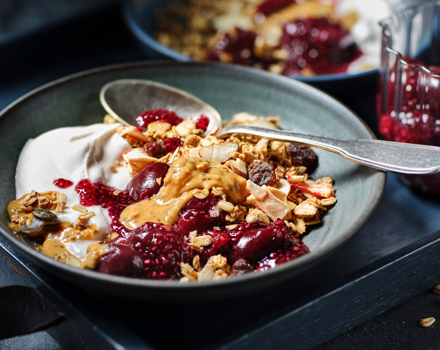 step 3 When you’re ready to serve add a spoonful of the yogurt mix to two shallow bowls. Spoon over the ‘jam’ and top with the M&S Brain Food granola super seeded (1/4 cup) and a spoonful of nut butter (1 1/3 tbsp).