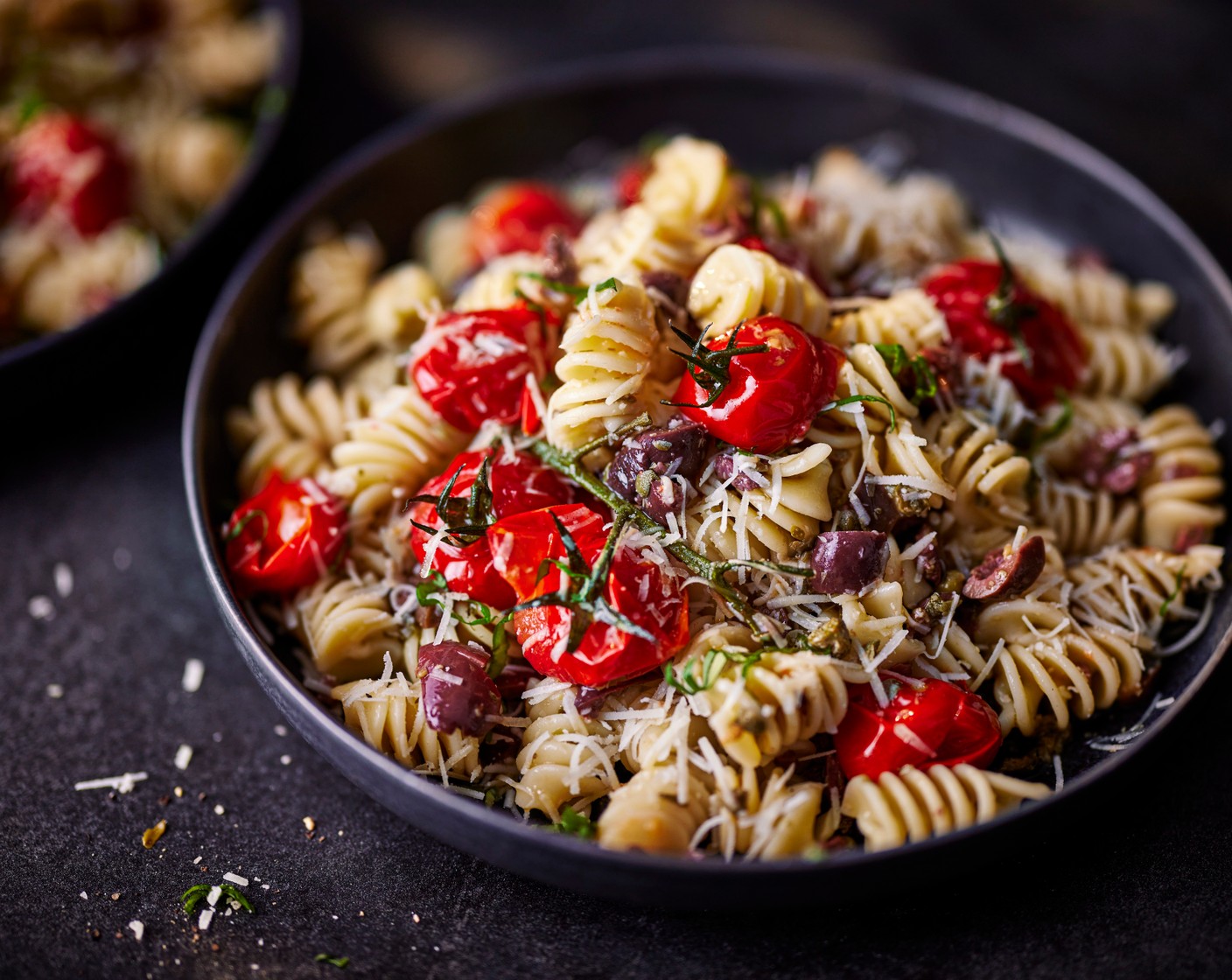 step 5 Toss in the cooled pasta and tomatoes (discard the tomato vines), and gently mix, crushing the tomatoes up slightly. Gently toss through the basil (15 g) and pecorino (100 g). Season to taste with salt and pepper.