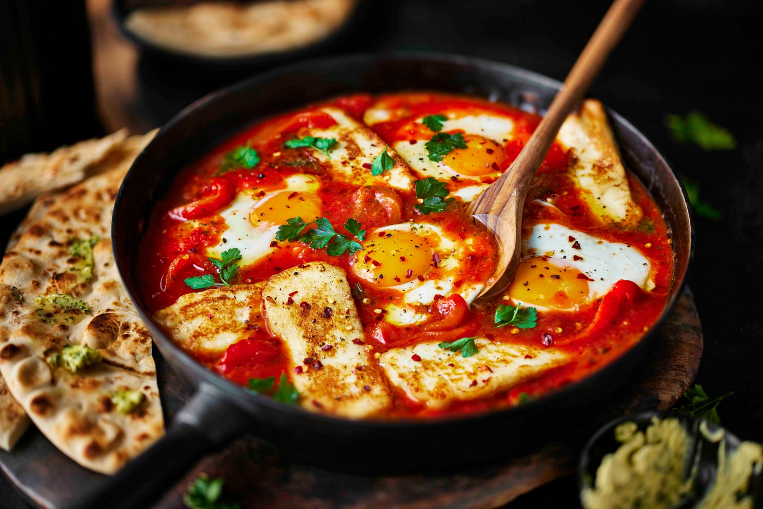 Garlic butter eggs and halloumi in purgatory