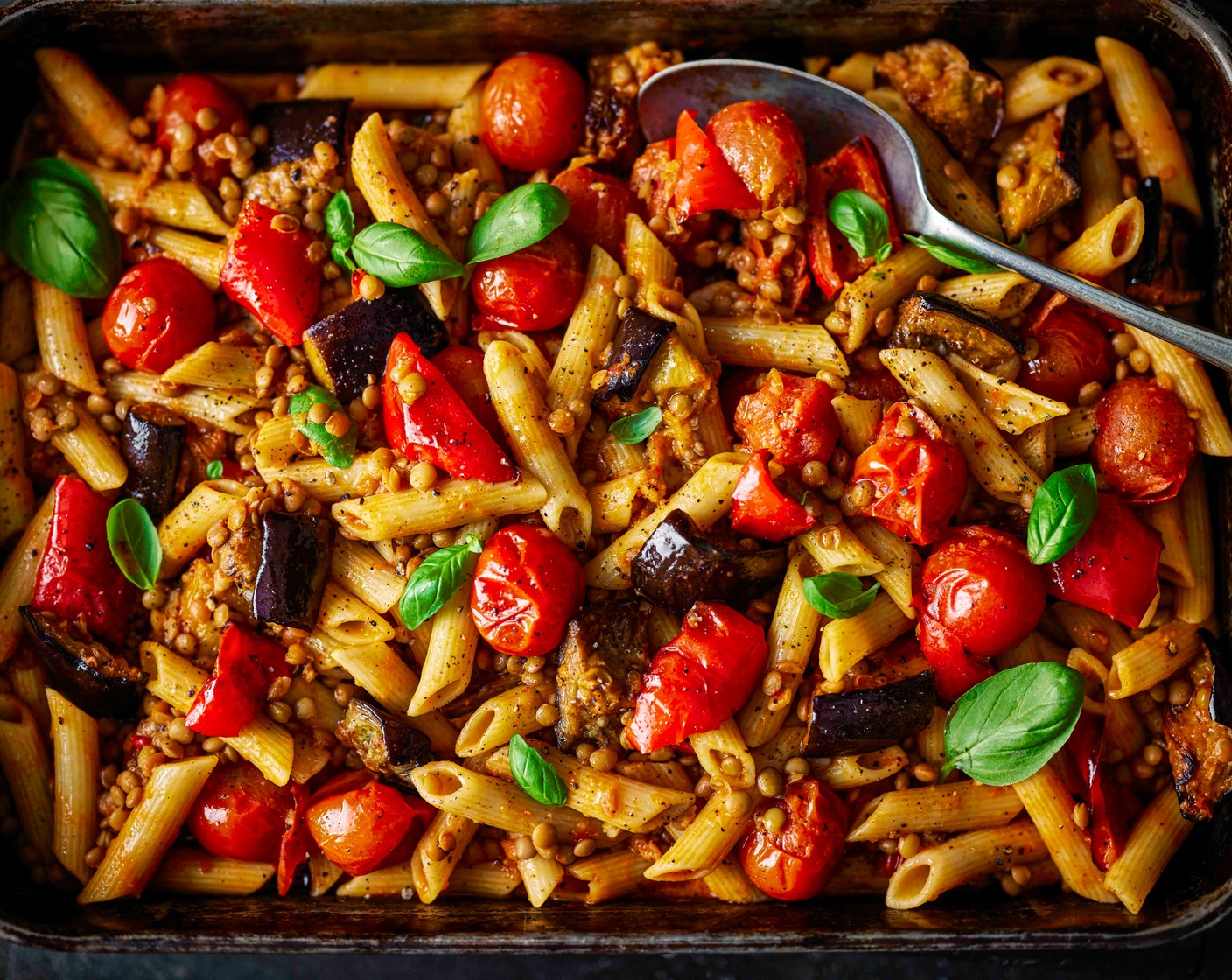 step 4 Remove the roasted veg from the oven. Using a slotted spoon, drain the pasta and add directly to the roasting tray, tossing to coat. Add a spoonful of pasta cooking water if needed to help create a glossy sauce. Garnish with the fresh basil (5 g) and serve.
