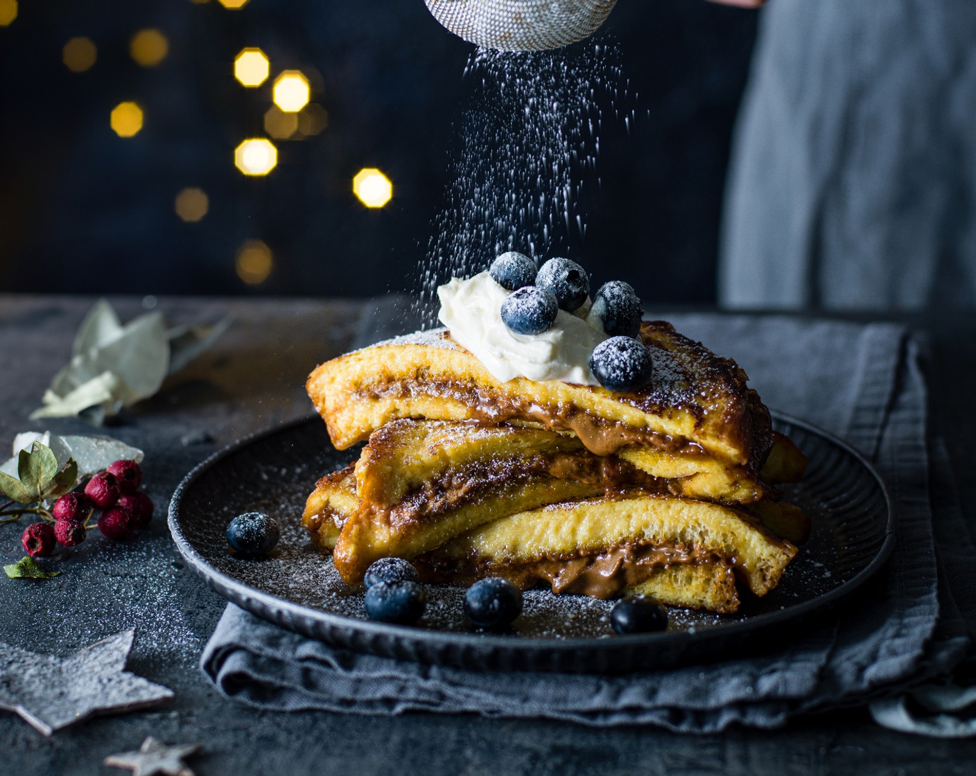 step 4 Heat the butter (1 knob) in a frying pan, then fry the sandwiches for a minute or so on each side, until golden. Serve with blueberries (to taste), crème fraîche (to taste) and a dusting of icing sugar (to taste).