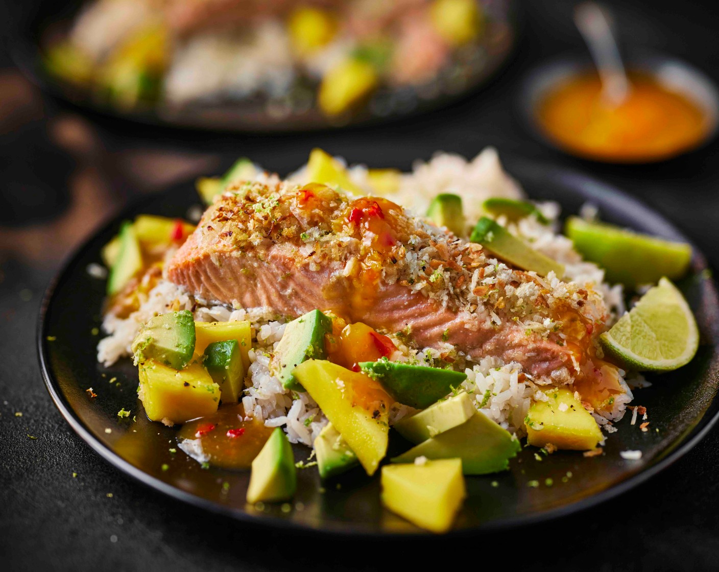 step 6 Spoon the rice into bowls and top with the salmon and mango salsa. Finish with a drizzle of hawwwt sauce (as needed). Serve with the remaining lime (1), cut into wedges.