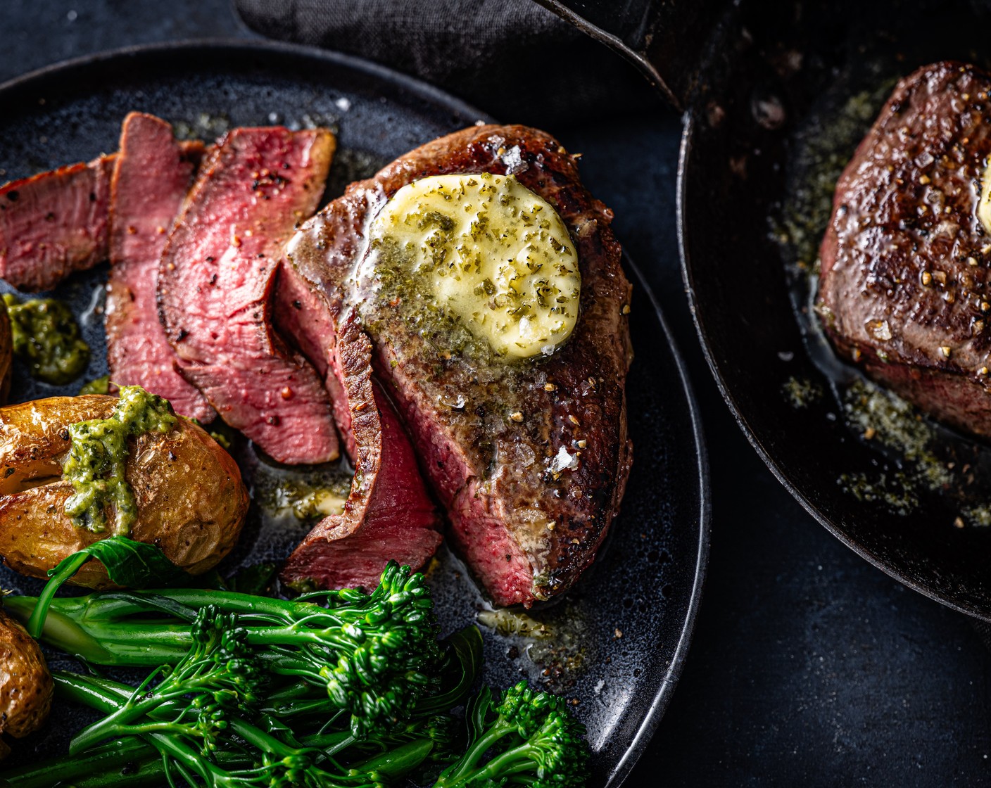step 9 Plate up the steaks with potatoes and broccoli. Add a knob of garlic and herb butter (2 knobs) to each steak and serve alongside the salsa verde dip included with the potatoes.