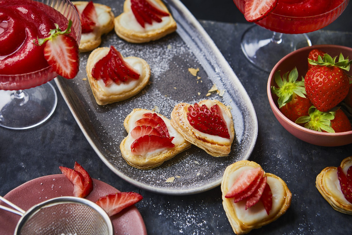 Strawberry Daiquiri cocktail with strawberry and ricotta heart-shaped tarts