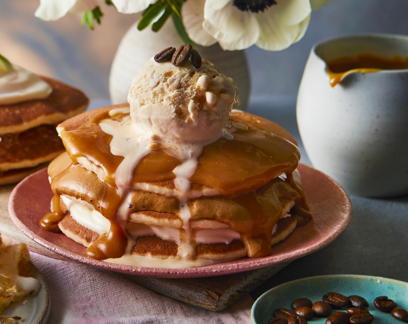 step 5 Finish with the third pancake and add a scoop of salted caramel ice cream (1 scoop), a drizzle of salted caramel sauce (as needed) and finish with coffee beans (3).