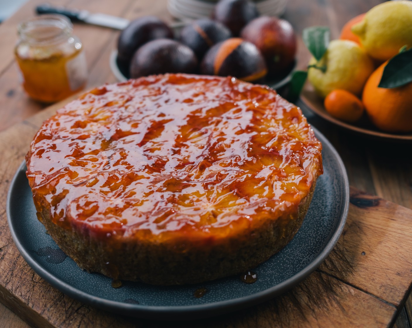 step 7 Remove the cake from the tin and leave to cool for 5-10 minutes. Tip the cake upside down onto a serving plate so that the layer of oranges are now on top. Spoon the glaze over the cake and spread it out evenly and then serve.