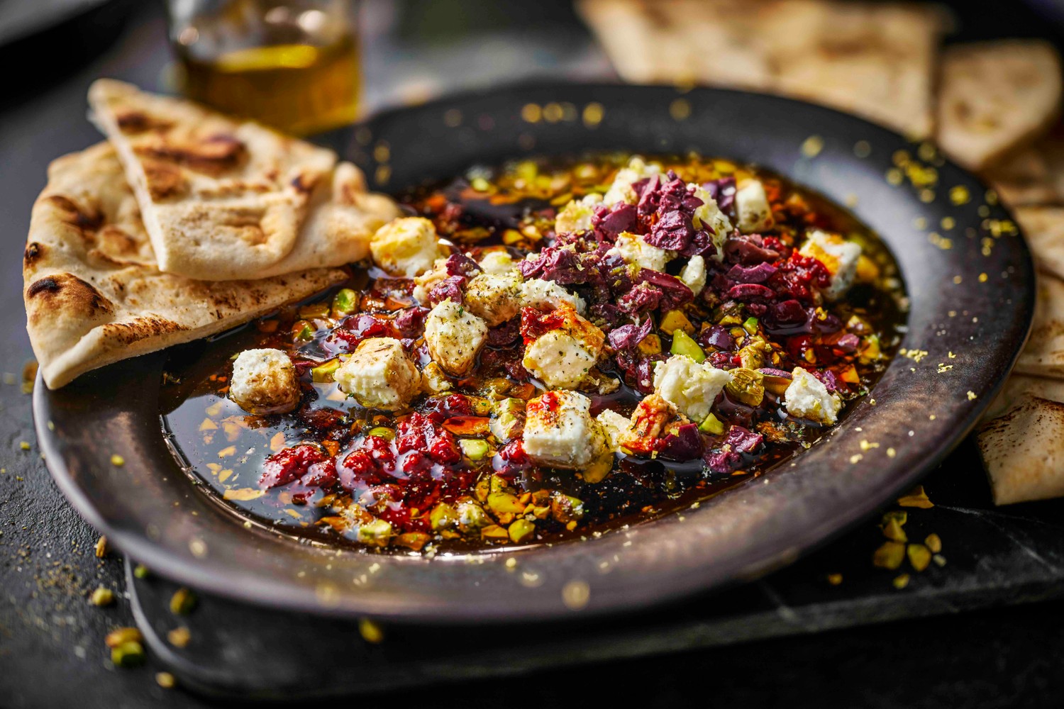 Olive, feta, pistachio and harissa dipping oil recipe