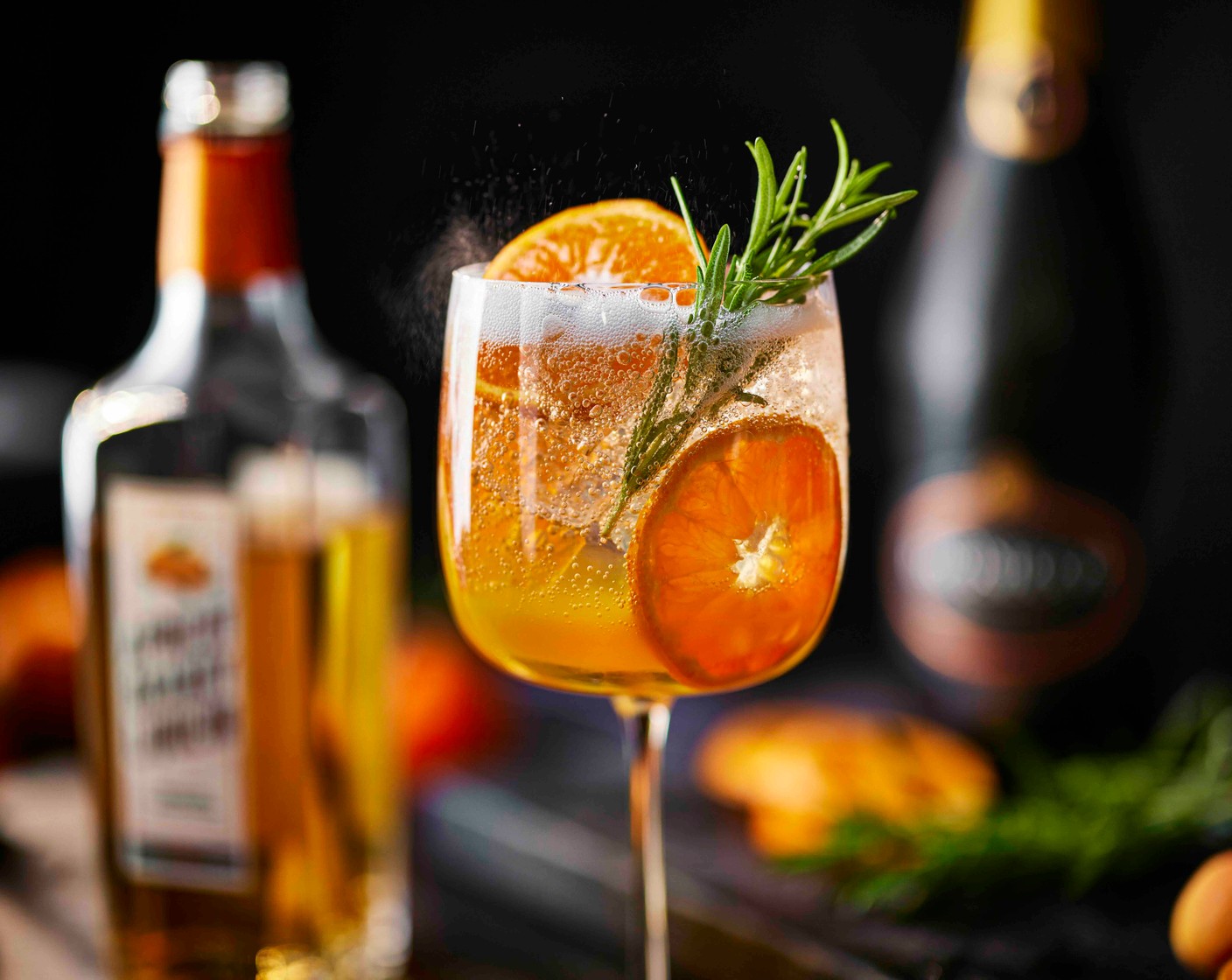 step 1 Fill a large wine glass with ice. Add the apricot brandy liqueur (40 ml), clementine juice (20 ml) and bitters (1 dash), if using. Top with the prosecco (100 ml) and soda water (25 ml), then stir gently to combine. Garnish with the rosemary sprig (1 sprig) and clementine slices (as needed) before serving.