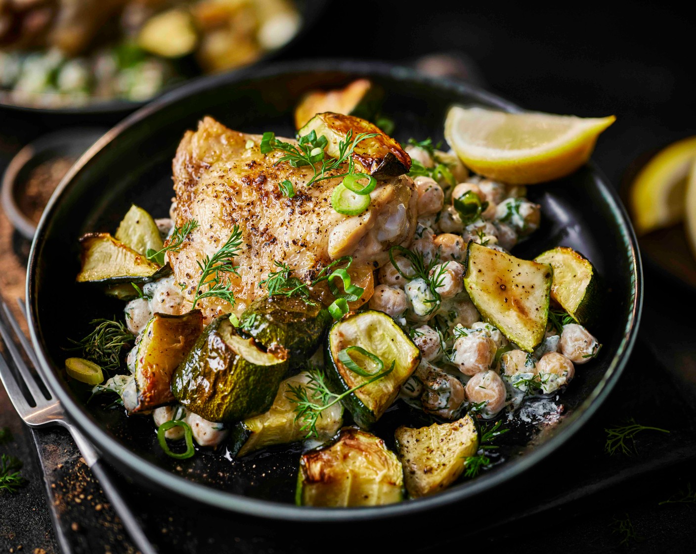 step 3 Divide the tzatziki chickpeas between bowls and top with the chicken and courgettes. Finish with the reserved dill and serve with the remaining lemon (1), cut into wedges.