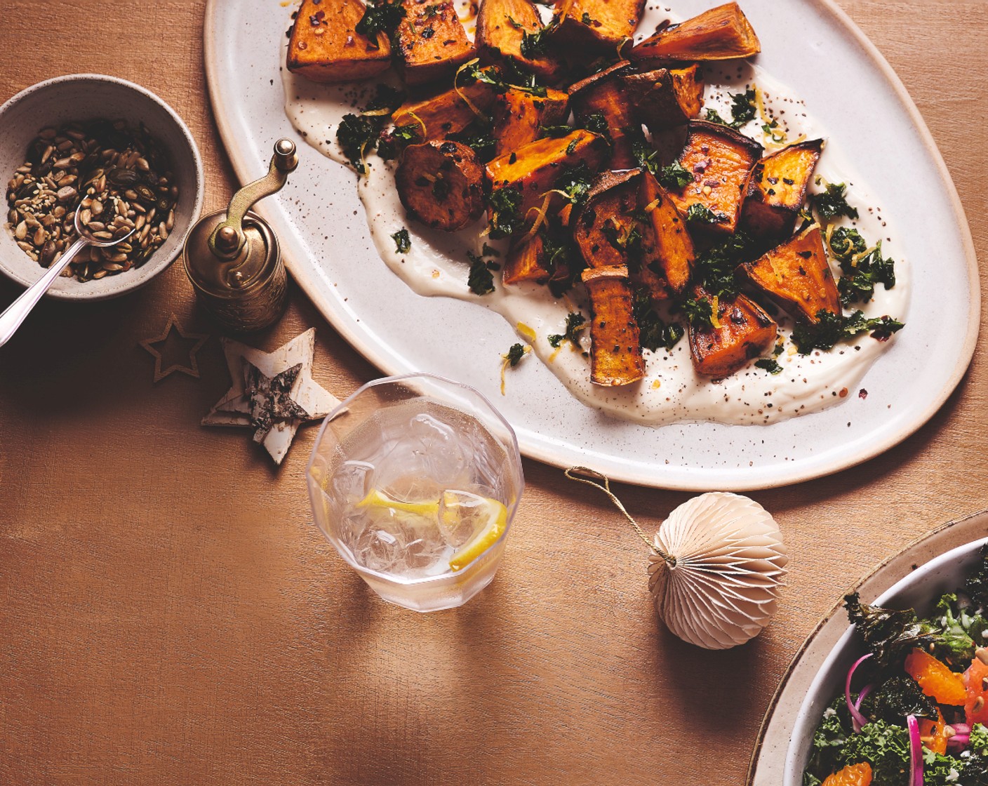 step 4 Spoon the yogurt dressing onto a shallow platter. Top with the roasted sweet potatoes and finish with the herby smash.