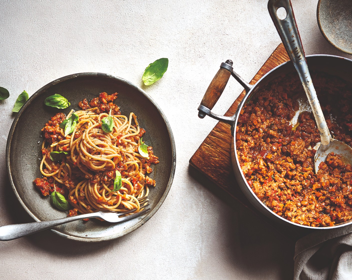 step 6 Stir the fresh basil (1 handful) through the sauce, then use tongs to toss the cooked spaghetti into the bolognese, adding a bit of pasta cooking water if it seems too dry. Serve with extra fresh basil on top.