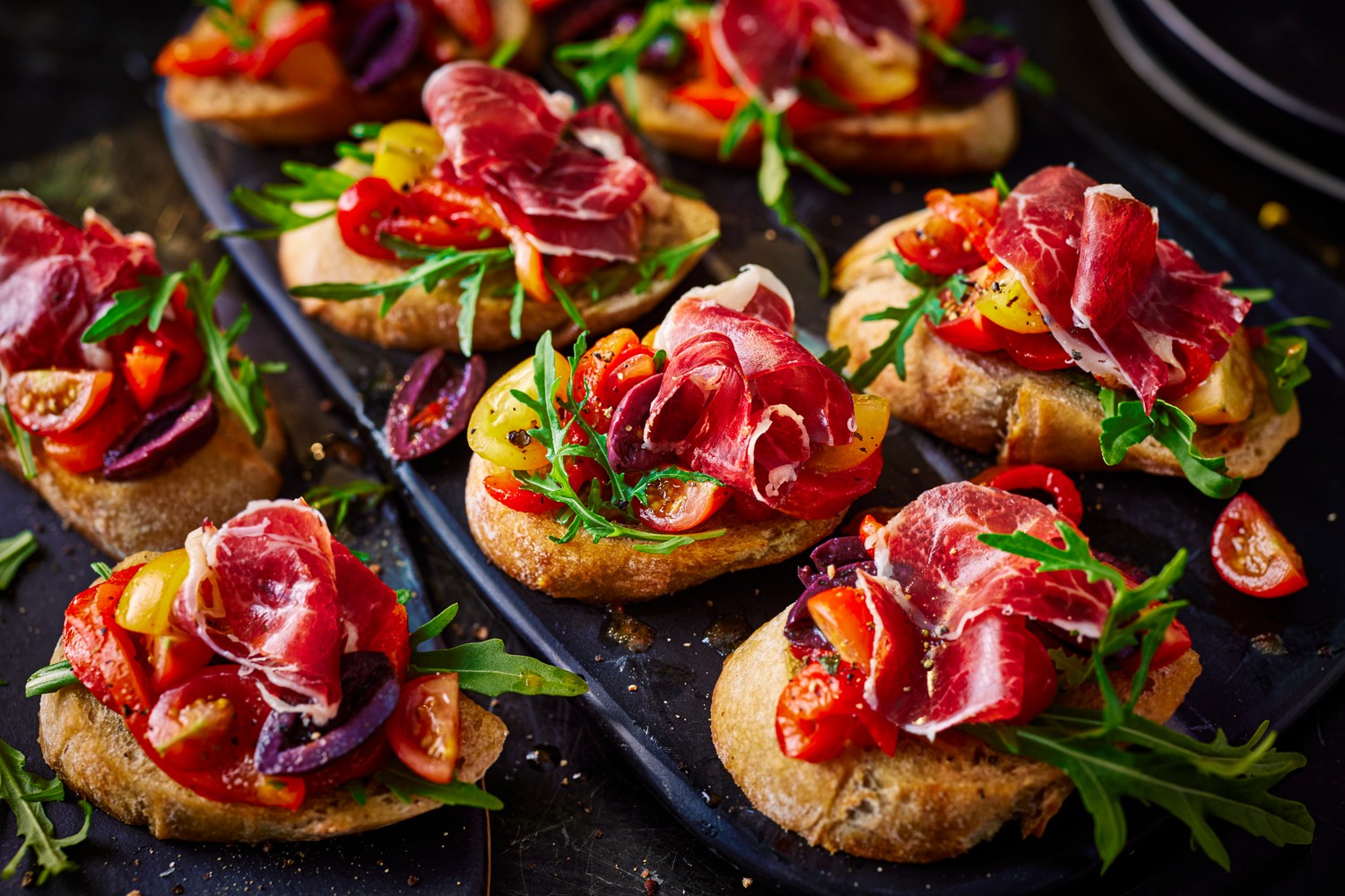 Ibérico ham, grilled pepper, olive and tomato toasts