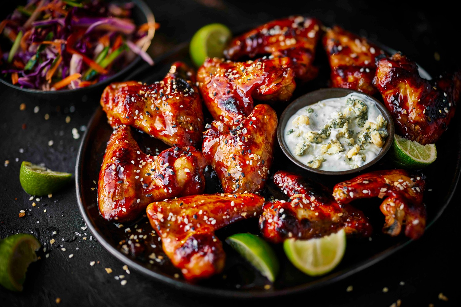 Sticky Buffalo chicken wings and rainbow slaw