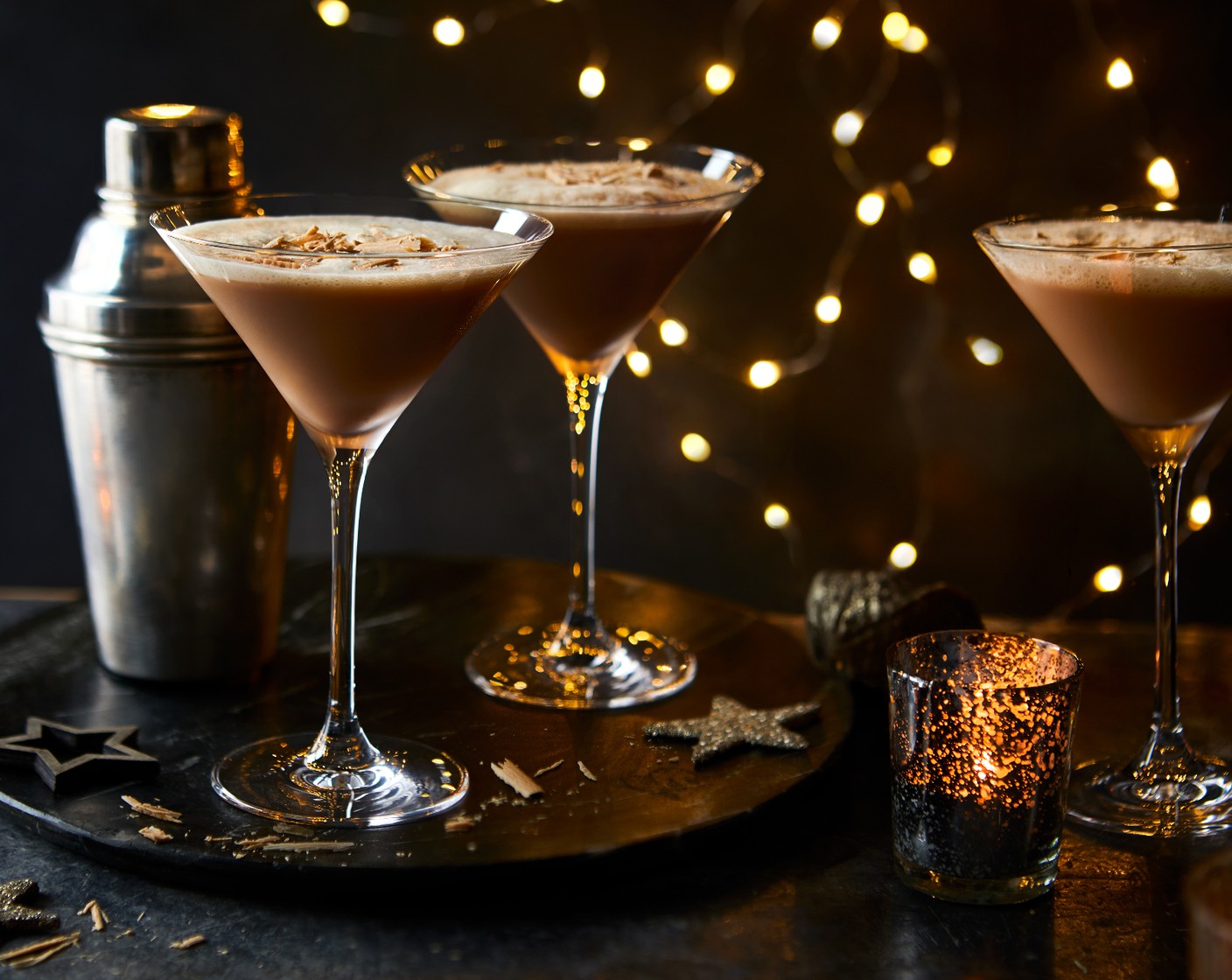 step 2 Strain into a glass and top with coffee beans (to taste) and chocolate shavings (to taste).