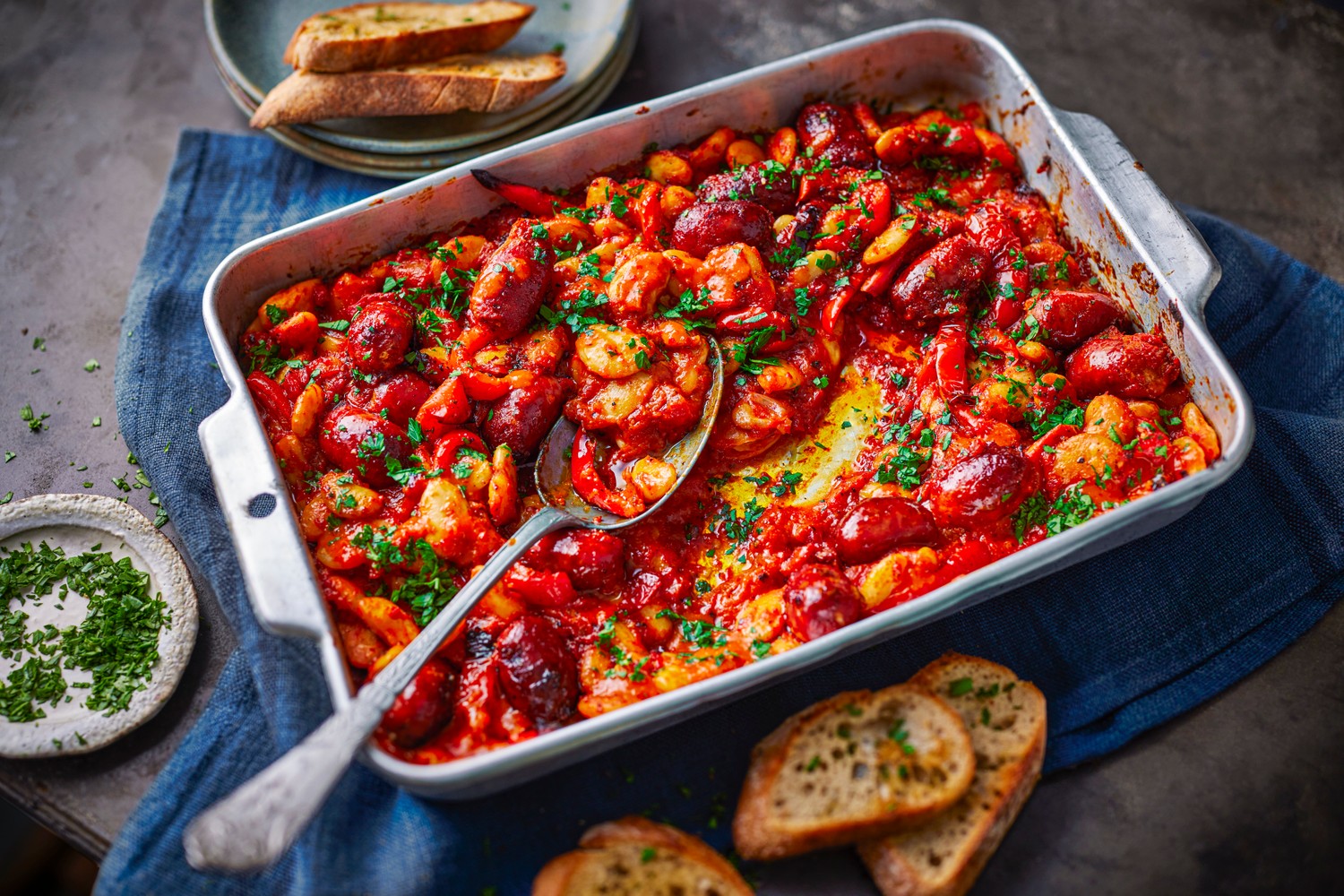 Spicy Calabrian sausage, butter bean and red pepper traybake