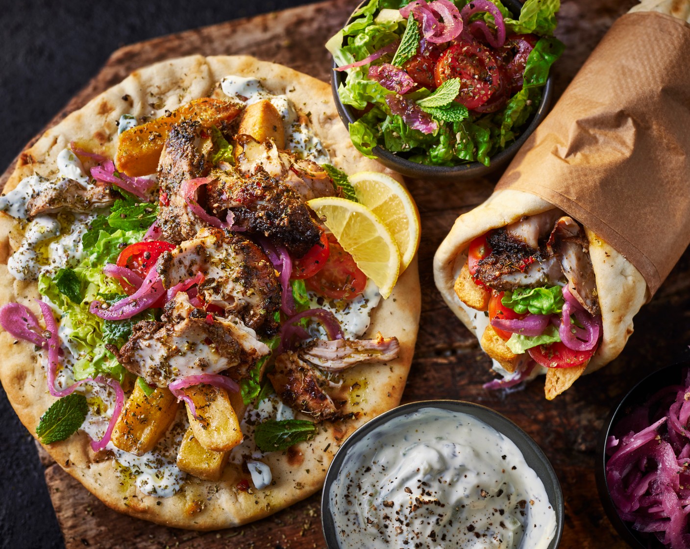 step 8 Dollop the tzatziki (as needed) onto the flatbreads, and top with the chicken, salad and chips.