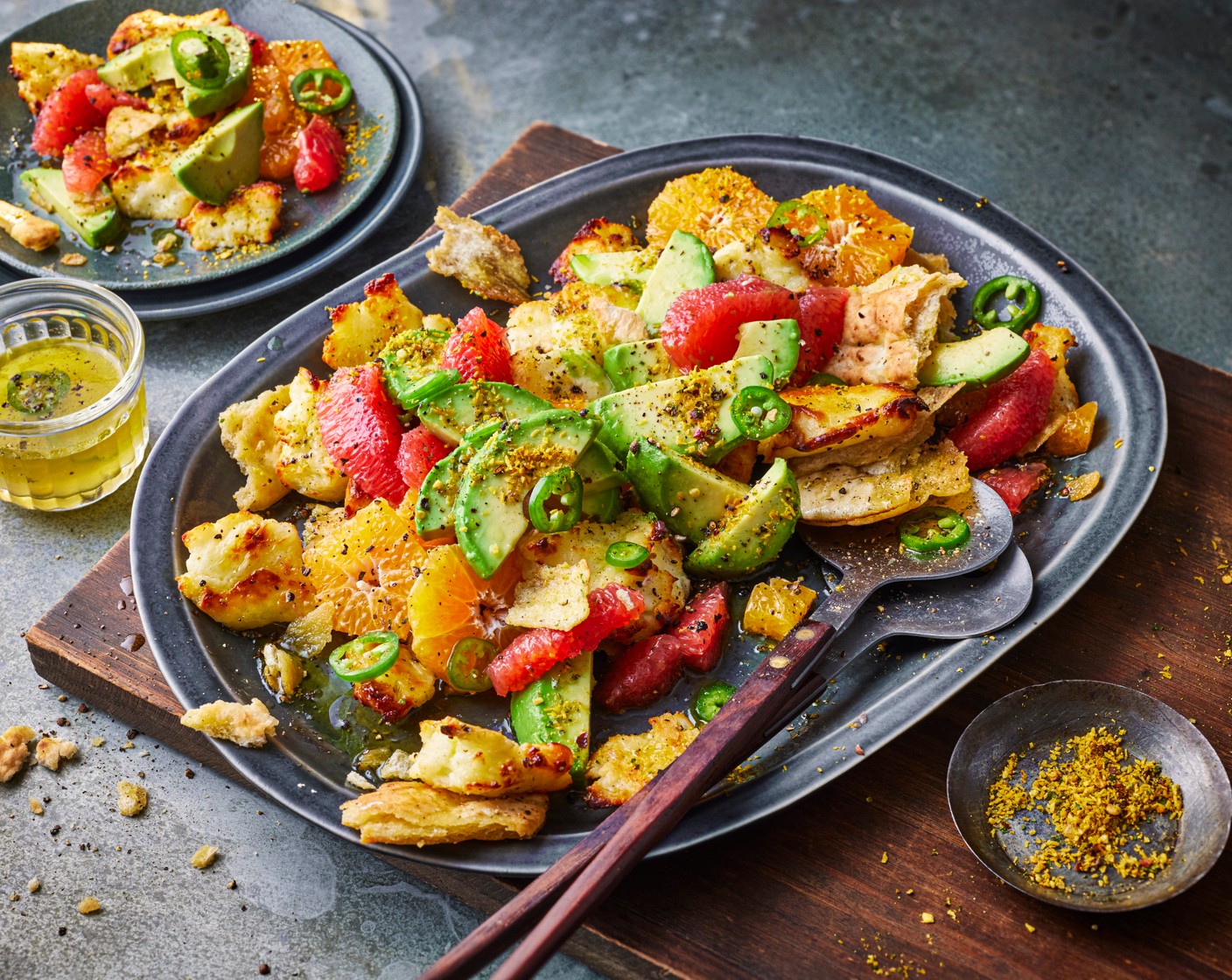 step 3 Tumble everything onto a platter then arrange the avocado slices (2) on top. Drizzle with any remaining dressing from the bowl and finish with a sprinkle of the coconut and lime seasoning (1 tsp).